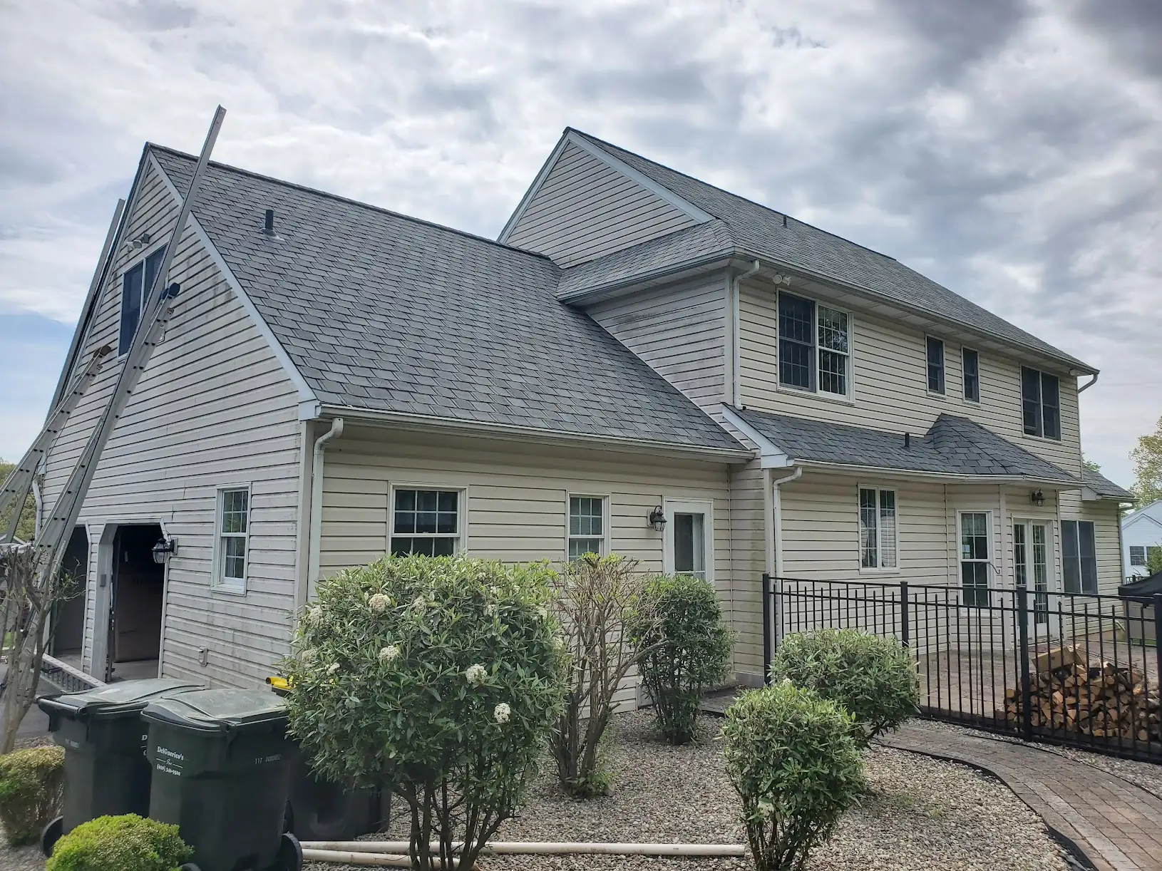 newtown-pa-siding-before.jpg vinyl siding replacement with black fascia and soffits Newtown PA