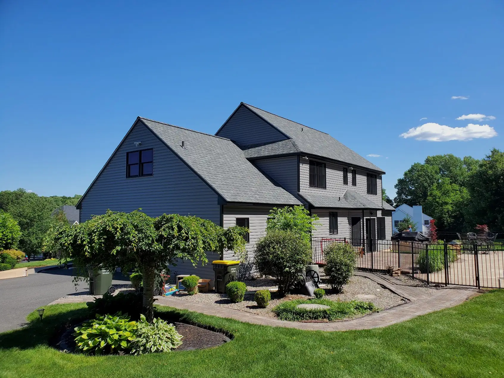 newtown-pa-exterior-remodel-after.jpg CertainTeed vinyl siding installation with black Andersen 400 windows Newtown PA
