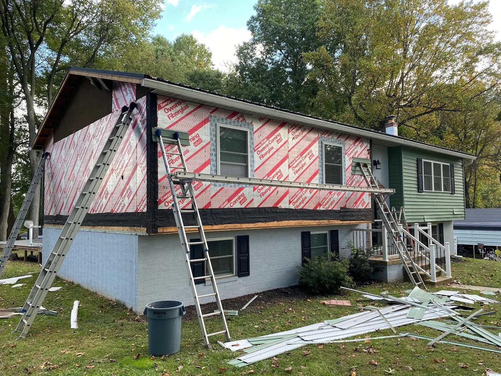 vinyl siding replacement with white trim and black shutters Morrisville PA